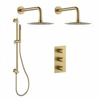 Brushed brass shower kit with 2 rain showerheads and 1 hand shower on a rail